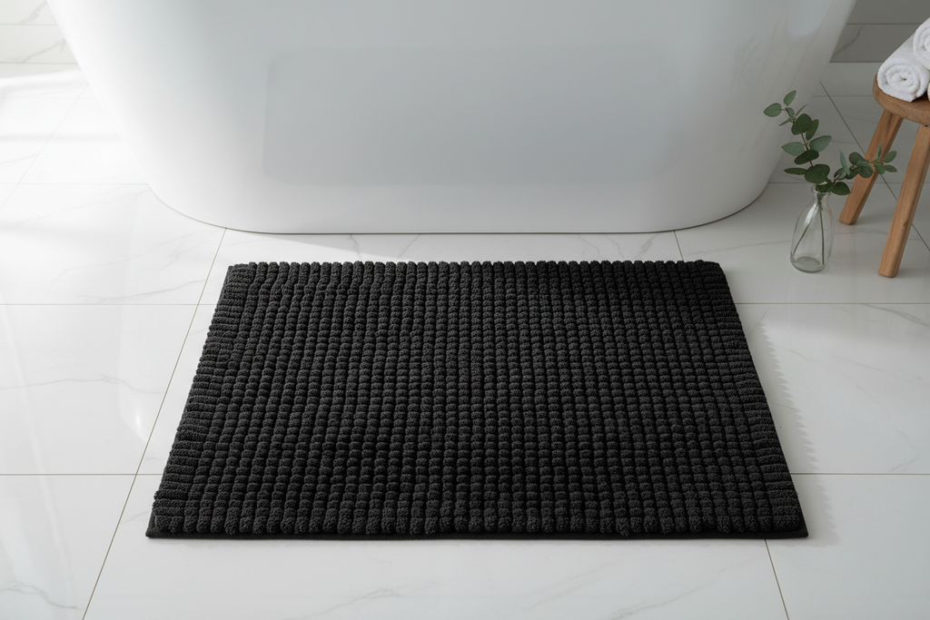 Black 1400 GSM Turkish cotton bath mat flat lay outside bathtub