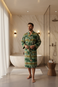 Man wearing striped botanical green Turkish cotton bathrobe in luxury bathroom