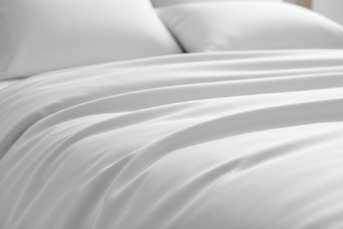 White 1500 thread count Egyptian cotton sateen sheet close-up fabric texture detail