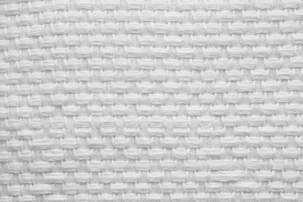Close-up of white organic cotton percale fabric texture