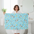Woman holding up blue Chihuahua novelty bath towel