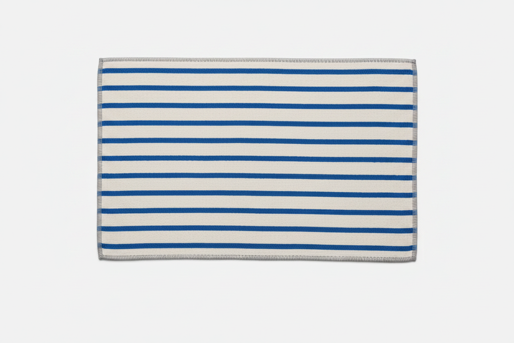 White and cobalt blue striped Turkish cotton bath mat flat lay product shot