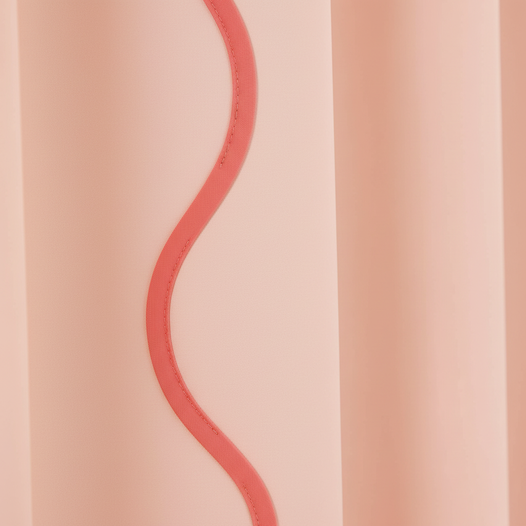 Close-up of blush peach shower curtain showing coral pink wavy scalloped edge trim detail along the side