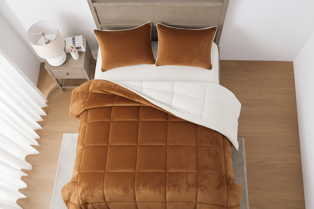 Overhead top-down view of king bed made with brown sherpa comforter set and two matching brown pillowcases