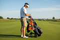 RokFit Gym Towel - golfer clipping towel to golf bag on course