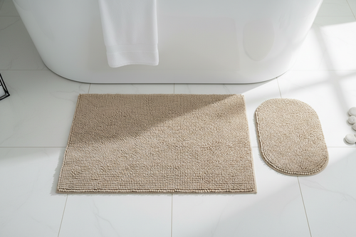 Beige 2-piece microfiber bath mat set flat lay outside bathtub
