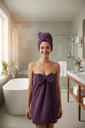 Women's purple coral fleece bow body wrap towel and matching bow hair turban - post-shower in bathroom